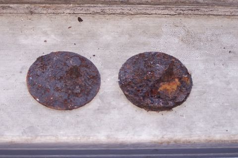1990 Ford Bronco - Close up of rusty washers nailed to bottom of frame