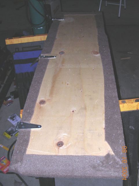 1994 Ford Bronco - I cut some 3/8 plywood to fit between the back of the front seats and little ledge in front of the back seat. i then added 3 hinges, and ca…