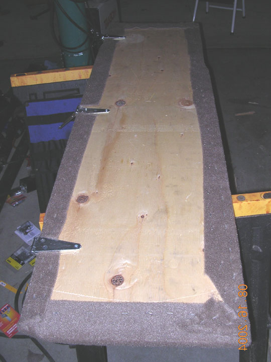 I cut some 3/8 plywood to fit between the back of the front seats and little ledge in front of the back seat.  i then added 3 hinges, and carpeted it to match the stock (though dirty) carpeting.