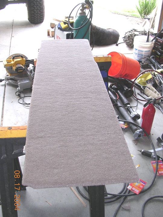 top of the shelf carpeted.  i had to clearance the shelf a little more on the drivers side.