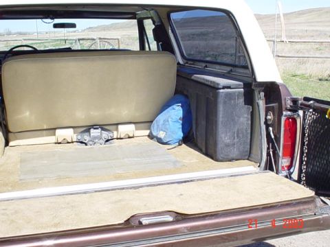 1979 Ford Bronco - The cargo area of a 1978 Ford Bronco, equipped with a rear seat and storage box.