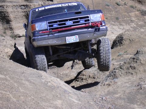 1991 Ford Bronco - This 1991 Ford Bronco is shown off-roading on a challenging dirt trail.