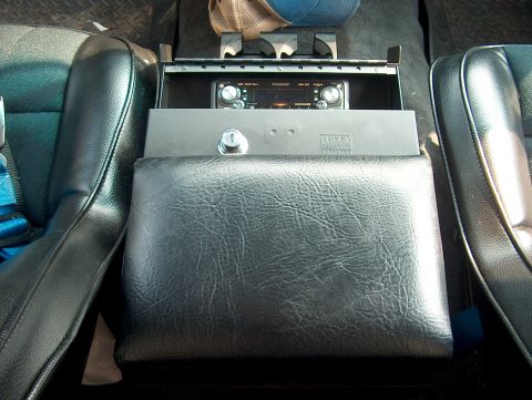 1994 Ford Bronco - Center console with a Tuffy lockbox and aftermarket radio installed.