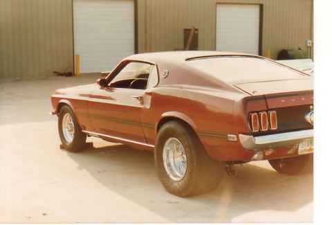 1968 Ford Mustang - This classic Mustang features a distinctive rear end with triple taillights and wide tires.