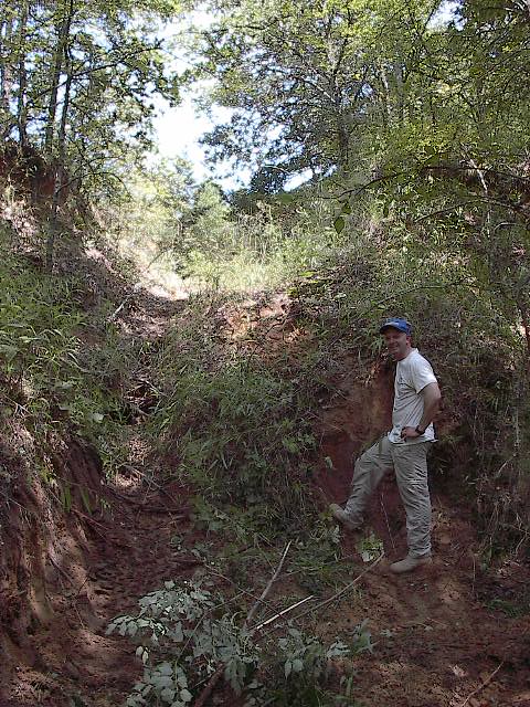 1986 Ford Bronco - This is the 4 ft wall right on the other side of the creek. 3 ft in back. 4 ft in front, no where to move.
