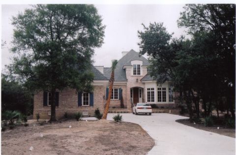 2000 Honda Accord - A white sedan is parked on the driveway in front of a large brick house with large trees surrounding it.