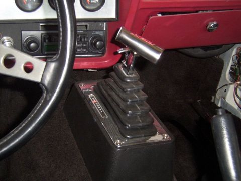 1978 Ford Mustang II - Interior view of a 1978 Ford Mustang II, highlighting the floor-mounted shifter and dashboard details.