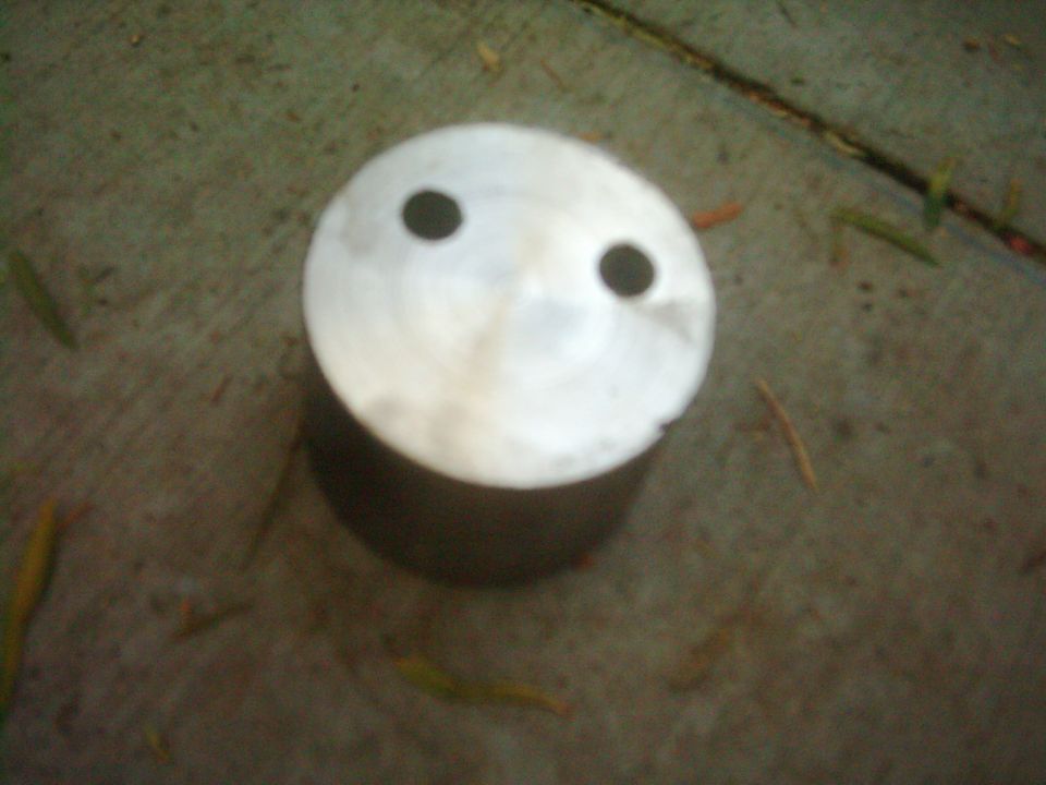 Piston with two holes resembling eyes