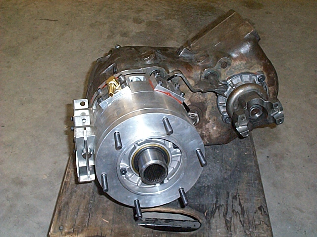 Transfer case assembly with output flanges sitting on a wooden board