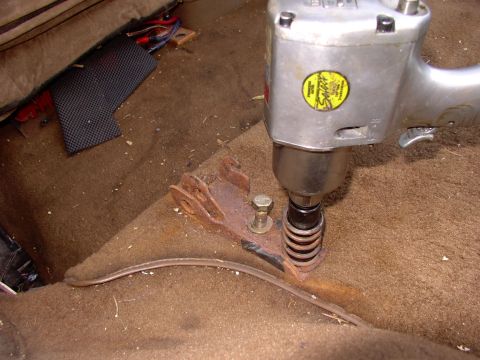1986 Ford Bronco - Now it's just a matter of using some brute force to back the seat bracket bolts out. I've had them all out before and you can see which one…