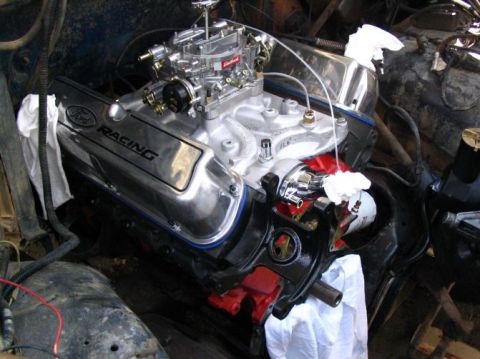 1984 Ford Bronco - The engine bay shows a polished Ford Racing valve cover and a Holley carburetor.