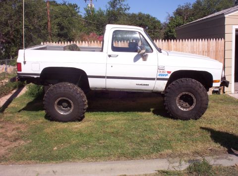 1988 Ford Bronco - This lifted pickup truck appears to be from the 1980s, not a 1988 Ford Bronco.