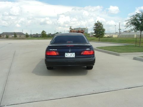 1993 Ford Taurus - Rear view of a 1993 Ford Taurus sedan.