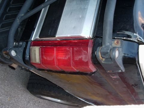 1993 Ford Bronco - Close-up of a vehicle's rear section, showing the tail light and bumper details.