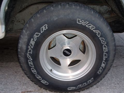 1993 Ford Bronco - The tire is a Goodyear Wrangler, mounted on a custom five-spoke alloy wheel.
