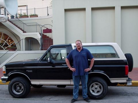 1993 Ford Bronco - A man poses with his black and tan 1993 Ford Bronco.