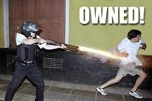 1985 Ford Bronco - Small internet meme photo of a helmeted person in dark tactical gear firing a paintball-style gun at a fleeing person against a green wall,…
