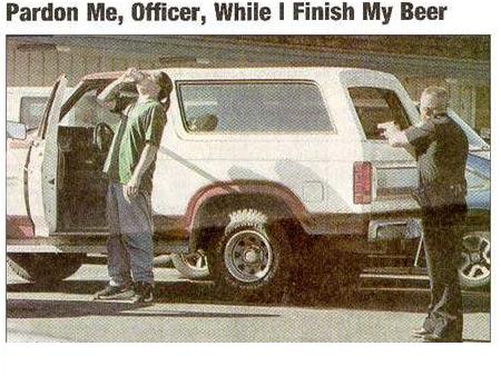 1985 Ford Bronco - Scanned newspaper clipping headlined 'Pardon Me, Officer, While I Finish My Beer,' showing a white full-size Ford Bronco at a curb with a u…