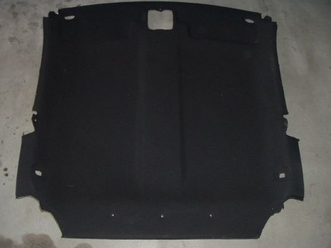 1994 Ford Probe - This is a black car headliner, likely removed from a vehicle for replacement or repair.