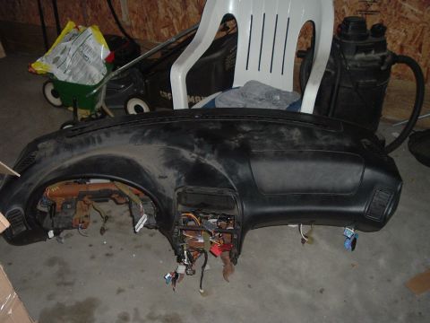 1994 Ford Probe - Dashboard removed from a vehicle, showing internal wiring and structure.
