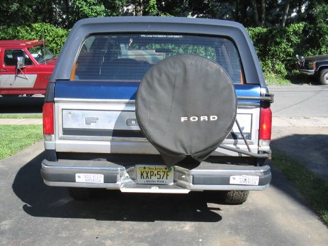 1979 Ford Bronco - Rear view of a Ford Bronco, showing its spare tire and license plate.