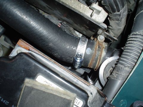1993 Ford Taurus - the temporary hose clamp job to keep it from leaking.. the hose is stiff.. and AutoZone doesn't have one.. Ford takes time to get one.. and…