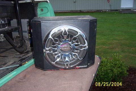 1996 Ford Bronco - A car subwoofer with a chrome flame grill is placed in the bed of a pickup truck.