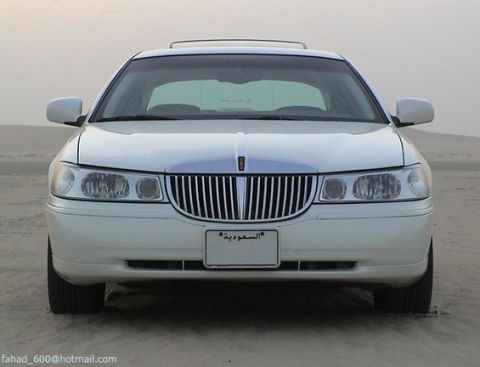 2002 Lincoln Town Car - White 2002 Lincoln Town Car photographed from the front in a desert environment.