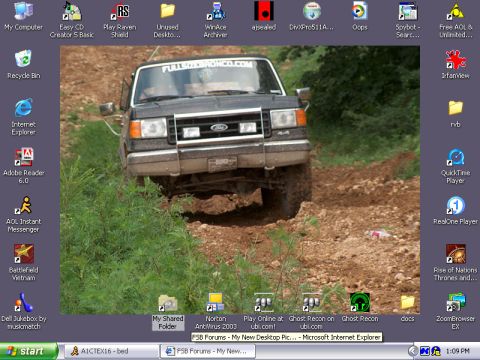 1988 Ford Bronco - This Ford Bronco is shown driving on a dirt path, kicking up dust.