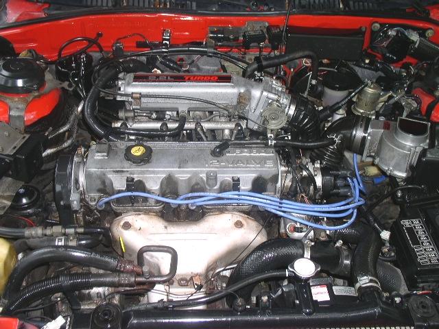 Turbocharged 2.2L 12-valve four-cylinder engine bay with blue plug wires