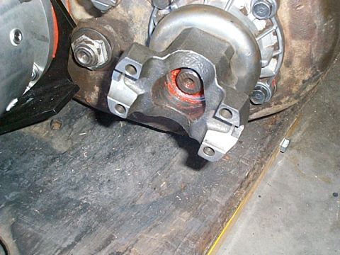 1994 Ford Bronco - This image shows a close-up view of a vehicle's driveshaft U-joint, likely during a repair or maintenance procedure.