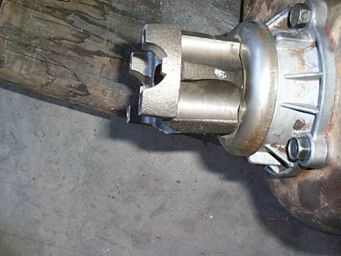 1994 Ford Bronco - Close-up view of a driveshaft U-joint connected to a differential housing, likely from a Ford Bronco.