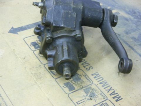 1990 Ford Bronco - Close-up of a steering gear box, a Ford logo on the attached arm.