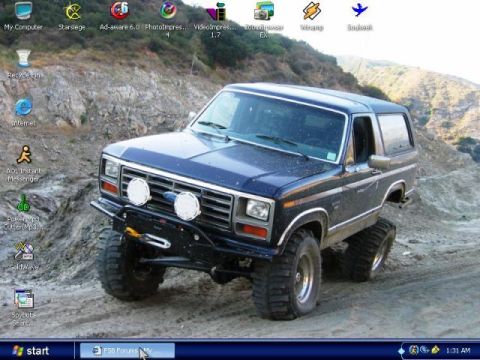 1985 Ford Bronco - This lifted 1985 Ford Bronco navigates a , off-road terrain.