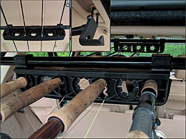 1996 Ford Bronco - Fishing rods are secured in holders mounted inside the vehicle's cabin.