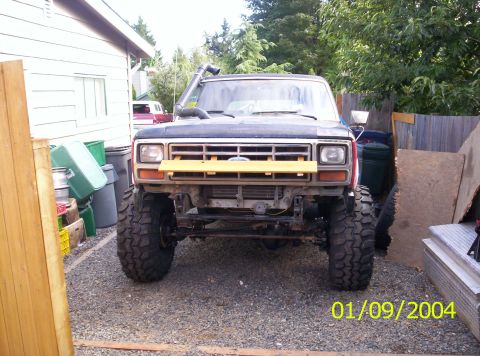 1983 Ford Bronco - This 1983 Ford Bronco features a snorkel and oversized tires, suggesting off-road modifications.