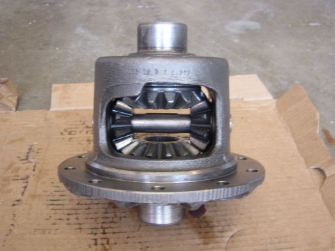 1990 Ford Bronco - A differential carrier with gears is shown, resting on a cardboard surface.