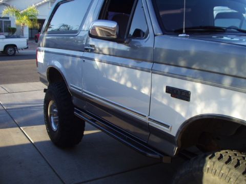 1993 Ford Bronco - This Ford Bronco features a two-tone paint scheme and aftermarket modifications.