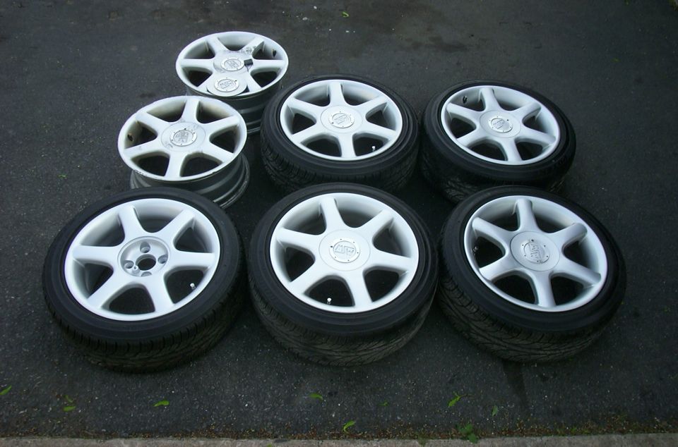 Set of six white 5-spoke alloy wheels with tires