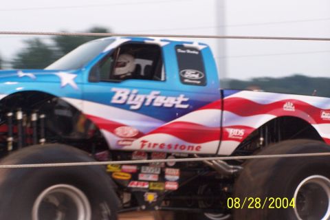 1979 Ford Bronco II - This monster truck features a patriotic paint job with stars and stripes, and the name 'Bigfoot' prominently displayed.