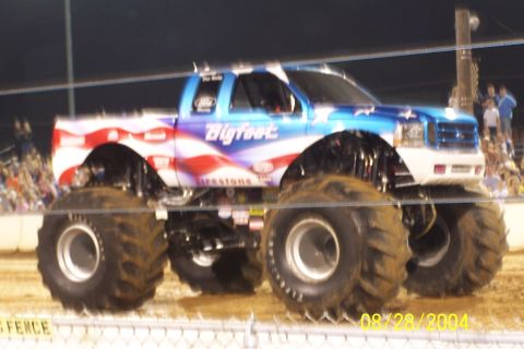 1979 Ford Bronco II - This monster truck features a patriotic paint scheme with stars and stripes, and the "Bigfoot" logo prominently displayed.