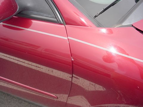 2001 Ford Taurus - quarter panel bent and pushed back into passenger door