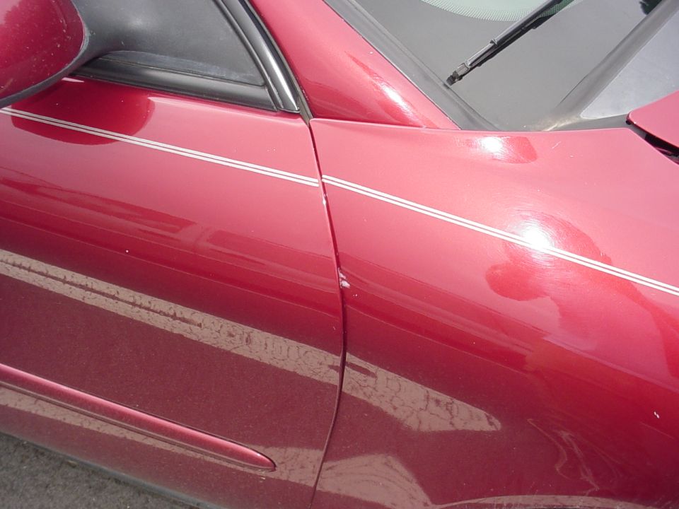 quarter panel bent and pushed back into passenger door