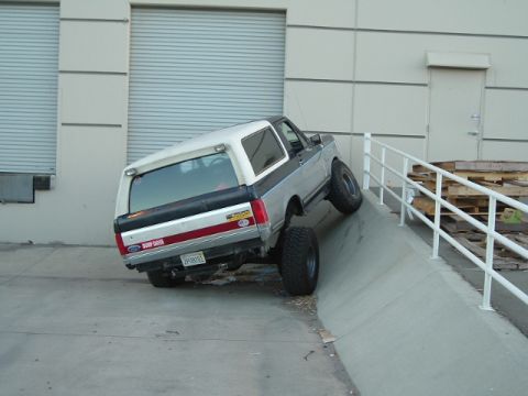 1989 Ford Bronco - Ford Bronco with lifted suspension on a concrete ramp.