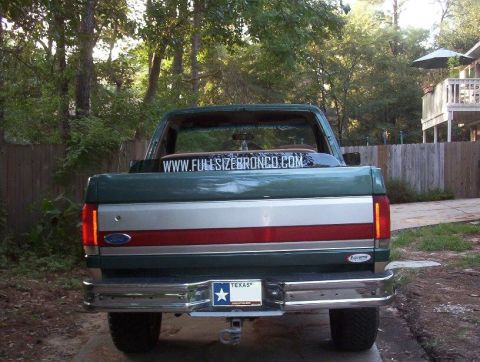1989 Ford Bronco - Rear view of a 1989 Ford Bronco with a custom tailgate panel and Texas license plate.