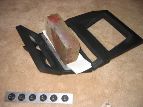 1995 Ford Bronco - Glueing the cup holder aluminum on.