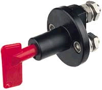 1983 Ford Bronco - A black battery disconnect switch with a red key is shown against a white background.