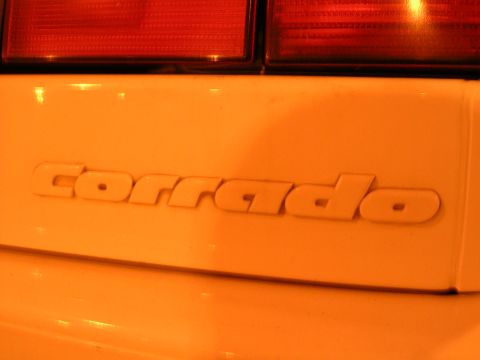 1990 Volkswagen Corrado - The rear emblem of a Volkswagen Corrado is shown, with part of the taillights above.