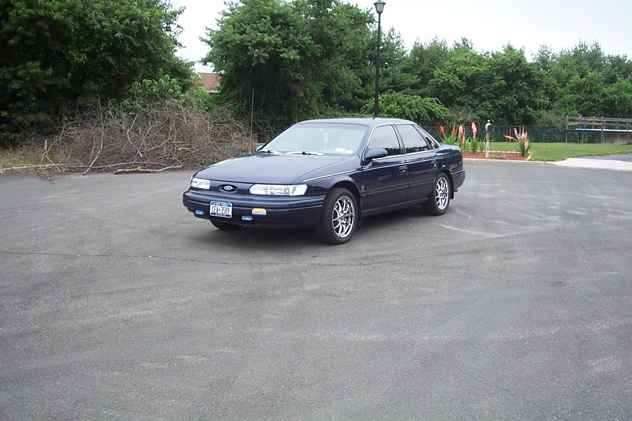 Dark blue 1993 Ford Taurus sedan parked on asphalt