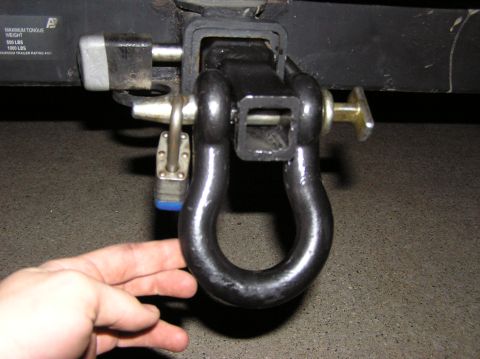 2000 Chevrolet Tahoe - A trailer hitch assembly is shown with a shackle and two locks, one of which has a blue casing.